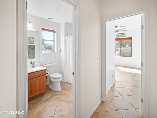 full bathroom with tile patterned flooring, toilet, visible vents, vanity, and a shower with curtain