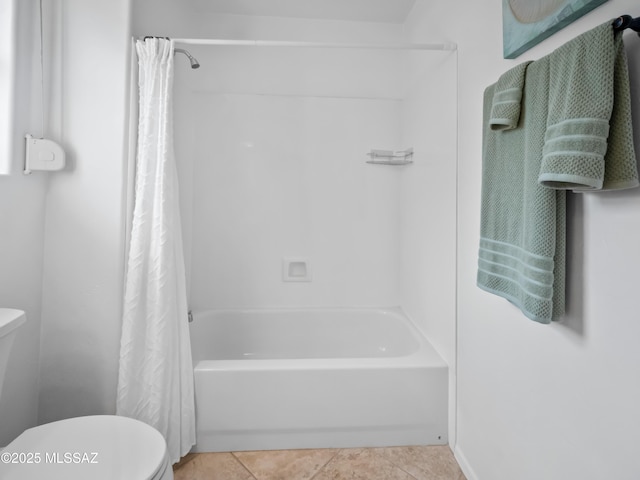 bathroom with shower / bath combo, toilet, and tile patterned floors