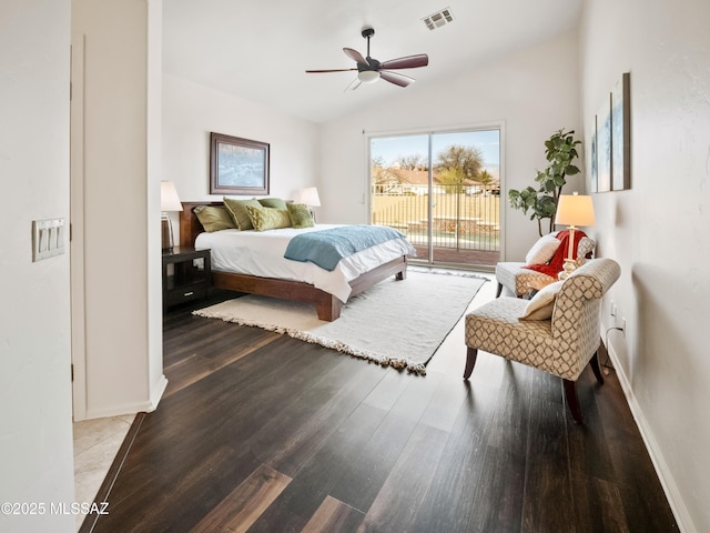 bedroom with visible vents, vaulted ceiling, wood finished floors, access to outside, and baseboards