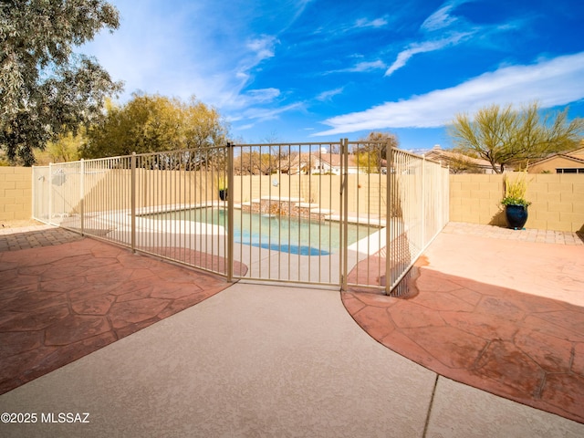 view of pool featuring a patio area, a fenced backyard, and a fenced in pool