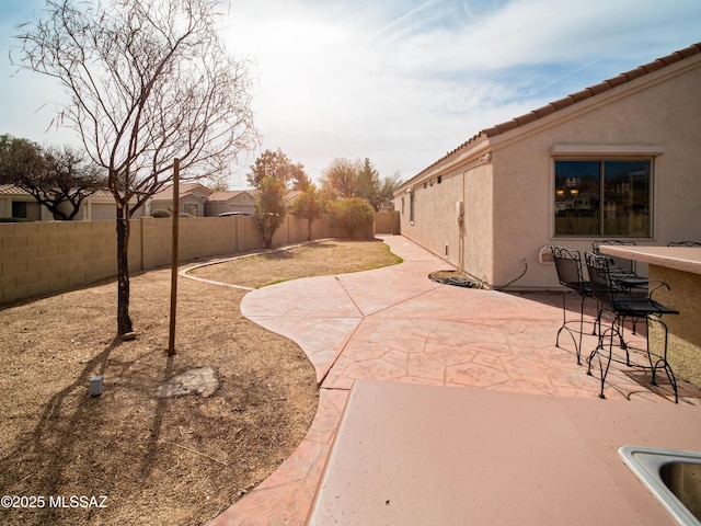 view of patio / terrace featuring a fenced backyard