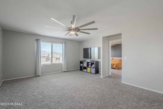 carpeted empty room with ceiling fan