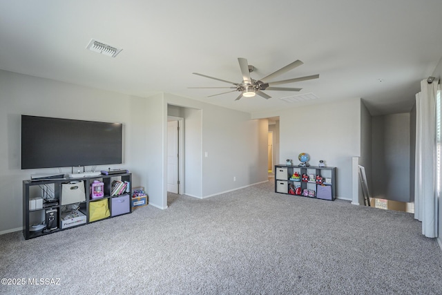 playroom with ceiling fan and carpet flooring