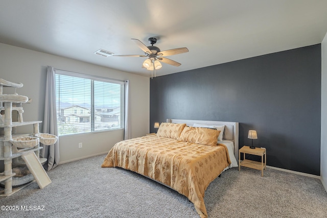 bedroom with ceiling fan and carpet