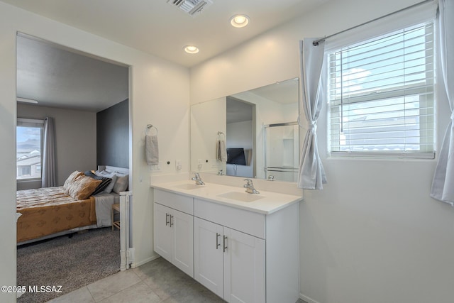 bathroom with tile patterned floors and vanity