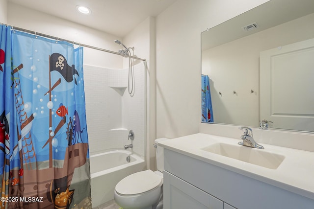 full bathroom featuring vanity, shower / tub combo with curtain, and toilet