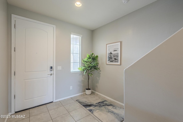 entryway with light tile patterned floors