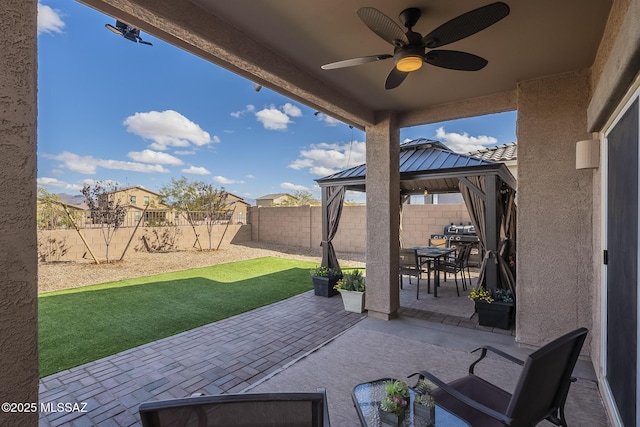 view of patio featuring a gazebo and ceiling fan