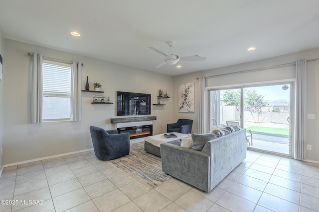 tiled living room with ceiling fan