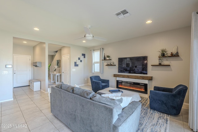 tiled living room featuring ceiling fan