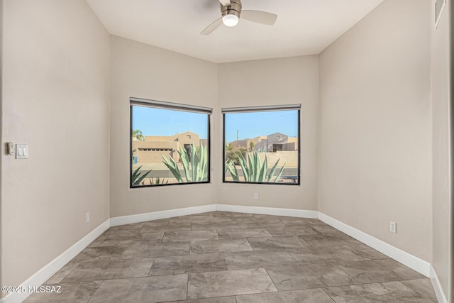 spare room with ceiling fan