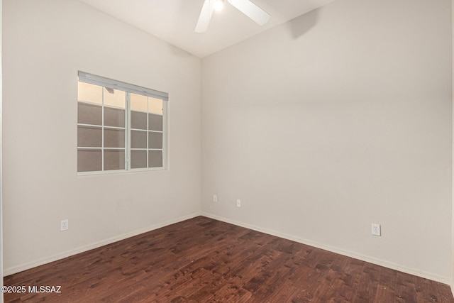 unfurnished room with ceiling fan and dark hardwood / wood-style flooring