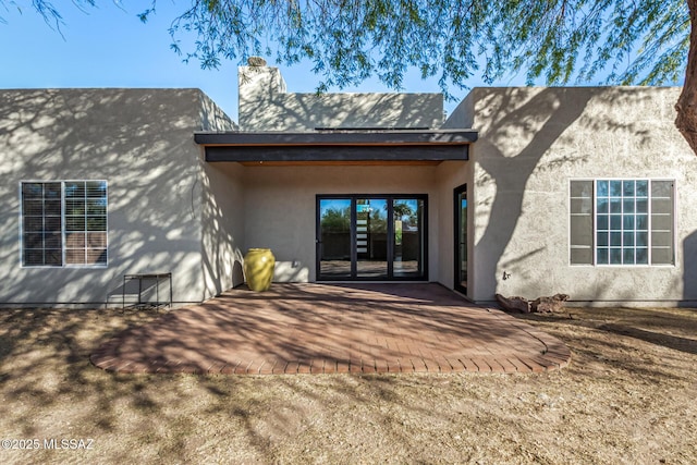 rear view of house with a patio