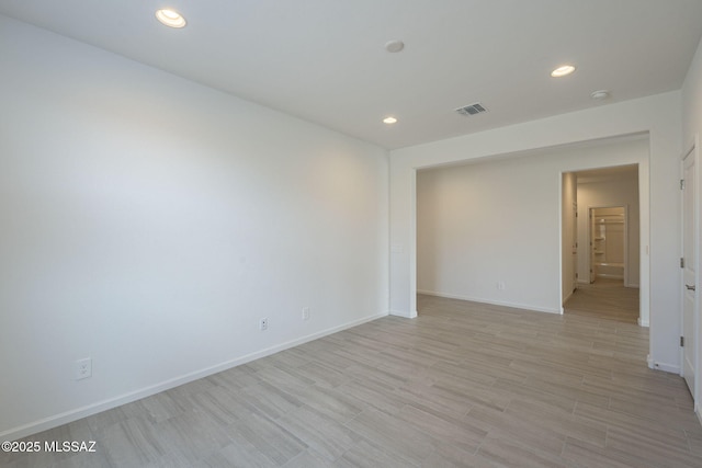 unfurnished room with light hardwood / wood-style flooring