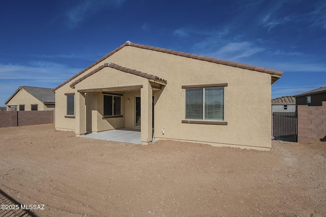 rear view of house with a patio area