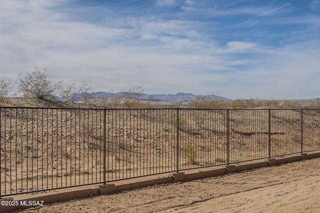 view of gate featuring a mountain view