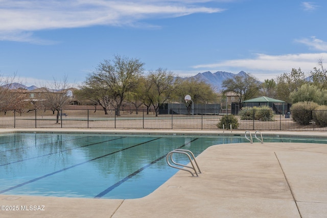 view of swimming pool featuring a mountain view