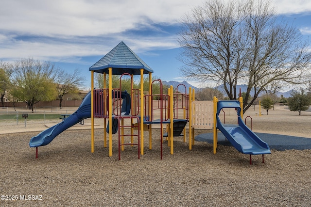 view of jungle gym featuring a mountain view