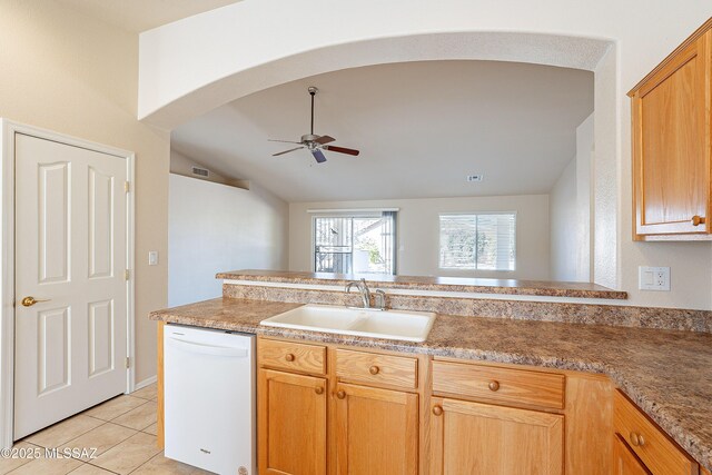 kitchen with ceiling fan, light tile patterned flooring, lofted ceiling, white dishwasher, and sink