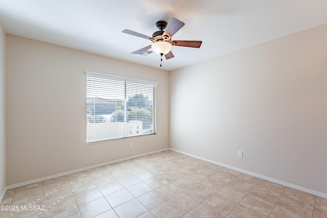 tiled empty room with ceiling fan