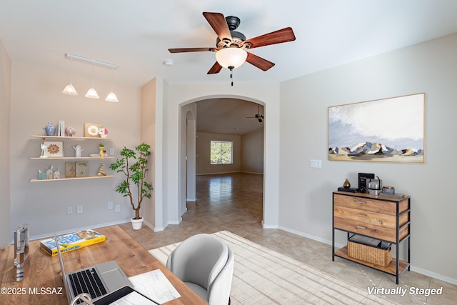 home office featuring ceiling fan and light tile patterned floors