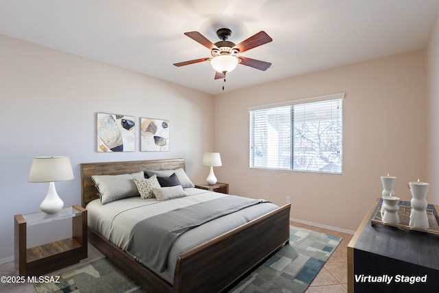 tiled bedroom featuring ceiling fan