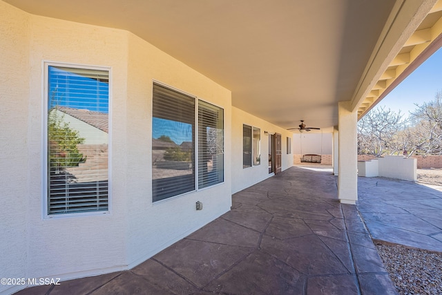 view of patio / terrace featuring ceiling fan