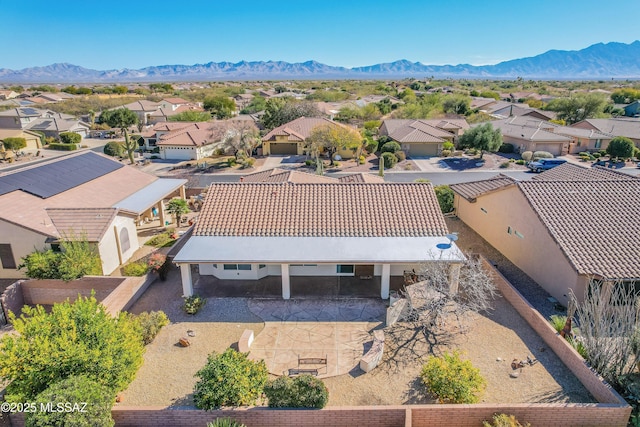 birds eye view of property featuring a mountain view