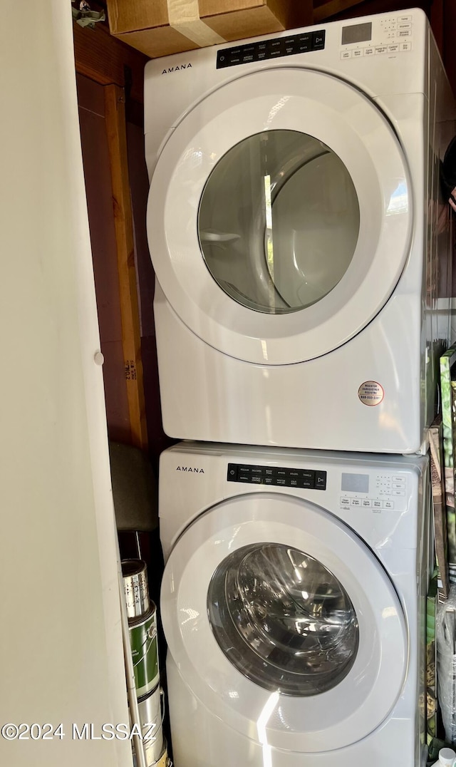 laundry area featuring stacked washer and clothes dryer