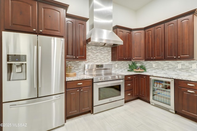 kitchen featuring decorative backsplash, ventilation hood, stainless steel appliances, and wine cooler