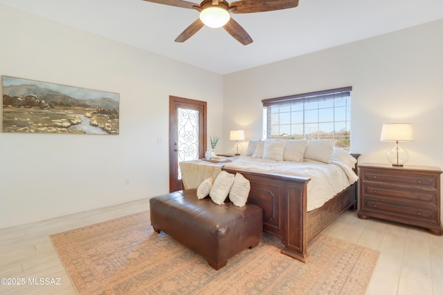 bedroom with ceiling fan and light hardwood / wood-style flooring