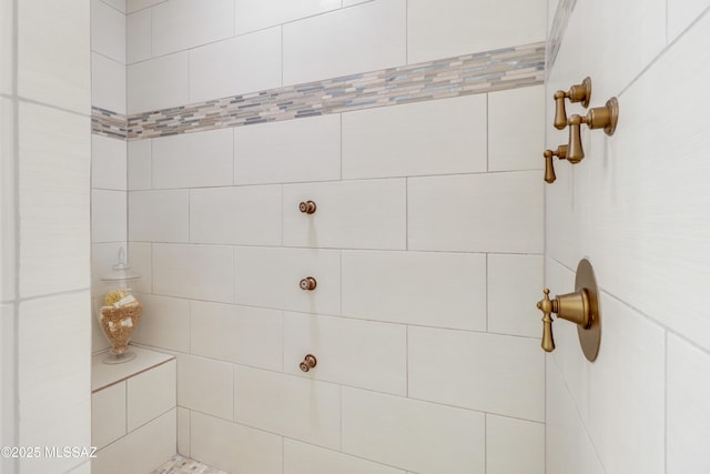 bathroom with a tile shower