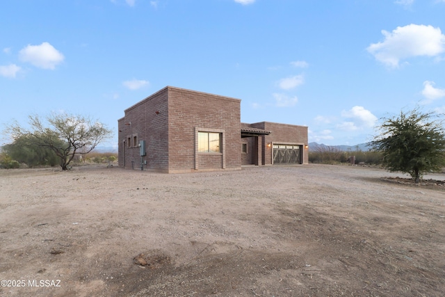 view of side of property with a garage