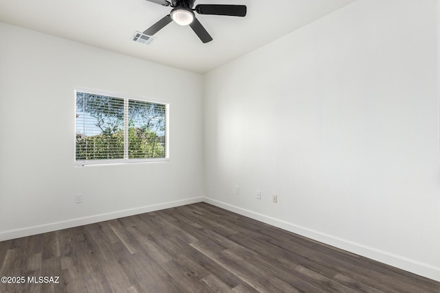 unfurnished room featuring ceiling fan and dark hardwood / wood-style flooring