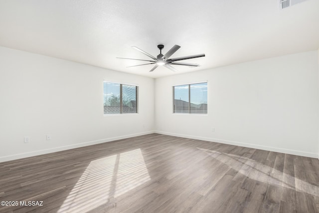 spare room featuring ceiling fan and wood-type flooring