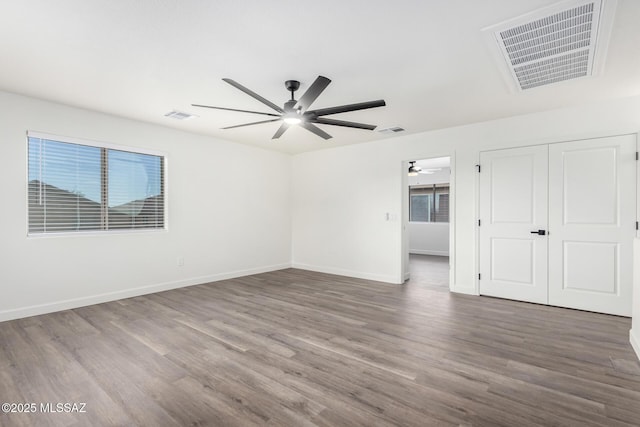 empty room with wood-type flooring