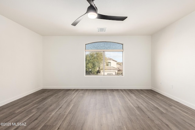 unfurnished room featuring ceiling fan and hardwood / wood-style flooring