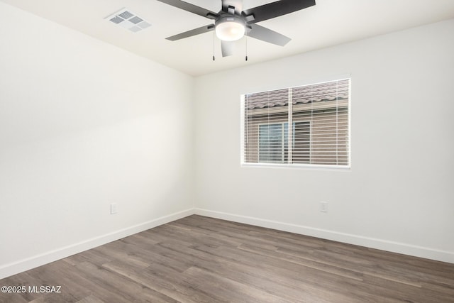 empty room featuring ceiling fan and hardwood / wood-style flooring