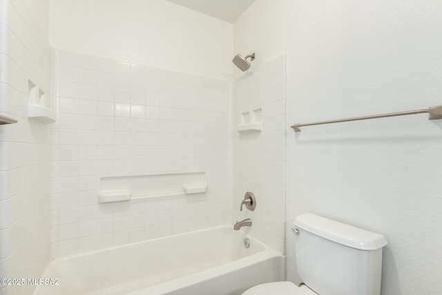 bathroom featuring toilet and bathing tub / shower combination