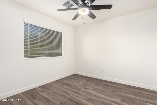 spare room featuring ceiling fan and dark hardwood / wood-style flooring