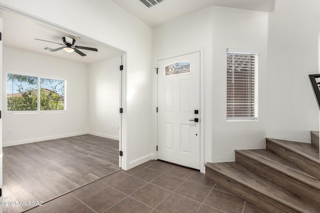 tiled entrance foyer featuring ceiling fan