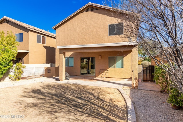 back of house featuring a patio