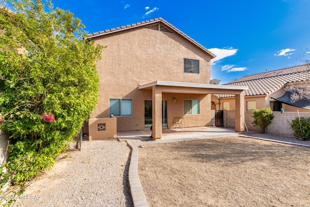 back of property featuring a patio area