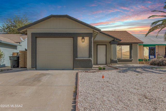 ranch-style home featuring a garage