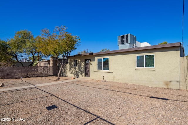 back of house with a patio and central air condition unit