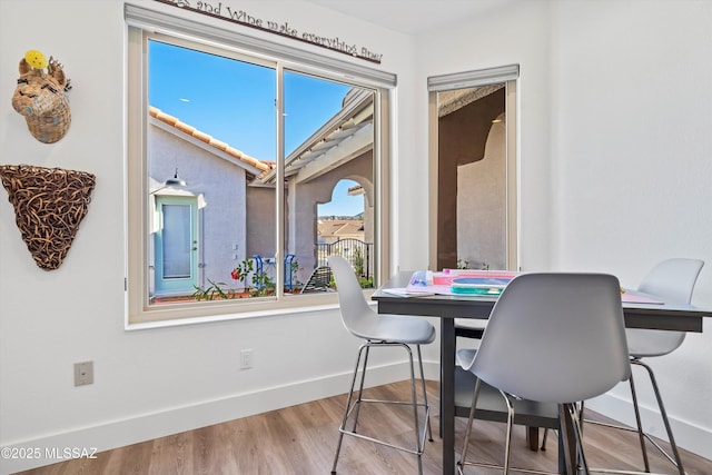 dining area with hardwood / wood-style floors