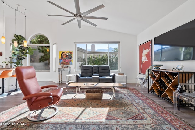 living room with ceiling fan, lofted ceiling, and dark hardwood / wood-style flooring