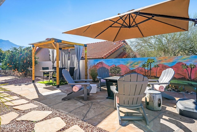 view of patio / terrace with a mountain view