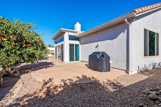 rear view of house featuring a patio