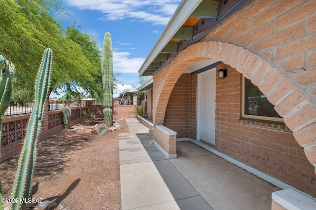 view of property exterior with a patio